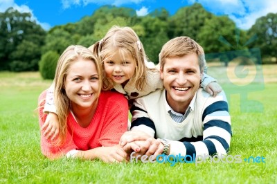 Smiling Family In Outdoors Stock Photo