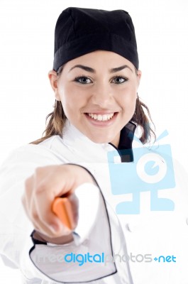 Smiling Female Chef Holding Knife Stock Photo