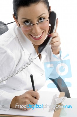 Smiling Female Doctor With Phone Stock Photo