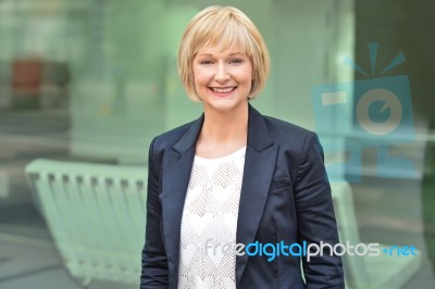 Smiling Female Executive Posing Confidently Stock Photo