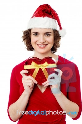 Smiling Female Posing With Christmas Gift Stock Photo