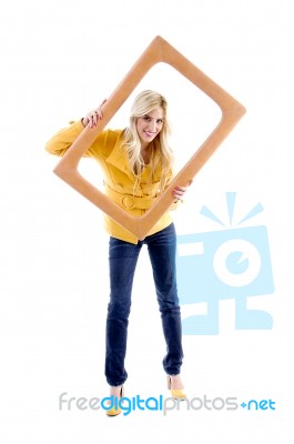 Smiling Female Posing With Frame Stock Photo