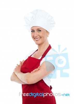 Smiling Female With Crossed Hands Stock Photo