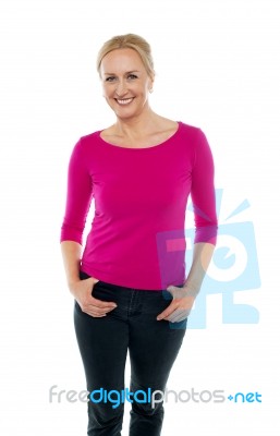 Smiling Female With Hands Pocket Stock Photo