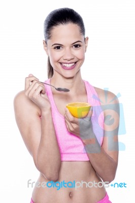 Smiling Fit Woman Having An Orange Stock Photo