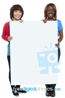 Smiling Friends Holding Blank Board Stock Photo