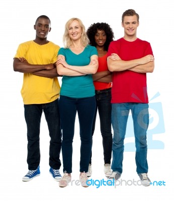 Smiling Friends With Arms Crossed Stock Photo