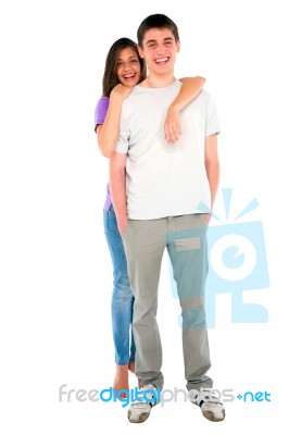 Smiling Girl Embracing Teenage Boy Stock Photo