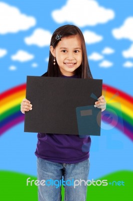 Smiling Girl Holding Black Board Stock Photo