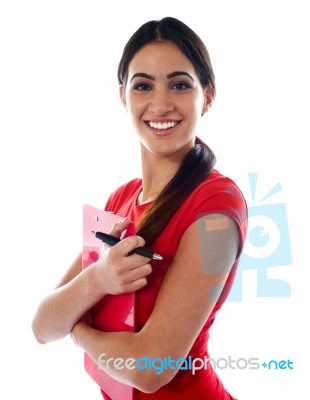 Smiling Girl Holding Clipboard Stock Photo