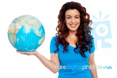 Smiling Girl Holding Globe Stock Photo