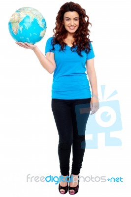 Smiling Girl Holding Globe Stock Photo