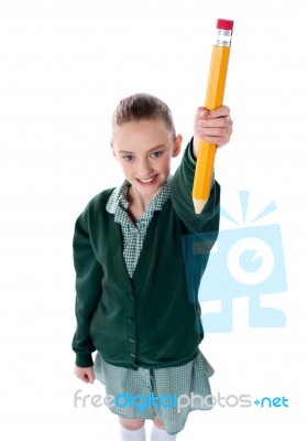 Smiling Girl Holding Pencil Stock Photo