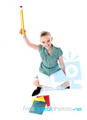 Smiling Girl Holding Pencil Stock Photo