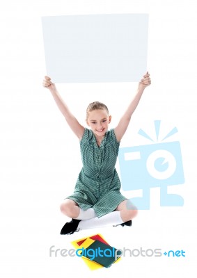 Smiling Girl Holding Whiteboard Stock Photo