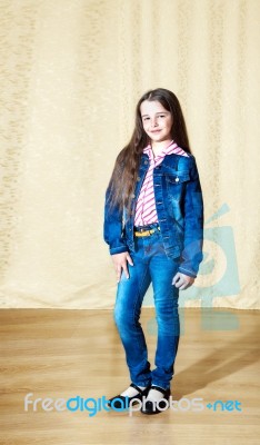 Smiling Girl In A Blue Denim Suit Stock Photo