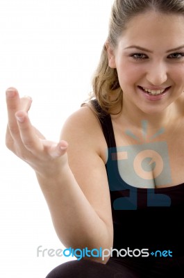 Smiling Girl Showing Hand Gesture Stock Photo