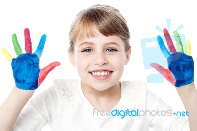 Smiling Girl Showing Her Painted Palms Stock Photo