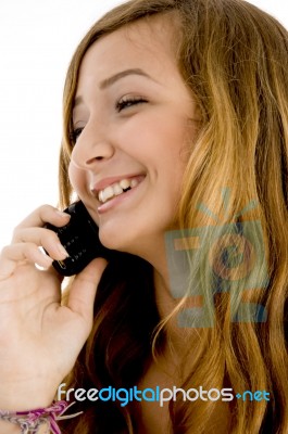 Smiling Girl Talking Over Cellphone Stock Photo