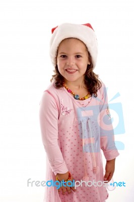 Smiling Girl Wearing Santa Hat Stock Photo