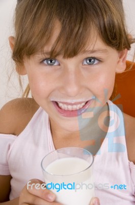 Smiling Girl With Glass Of Milk Looking You Stock Photo