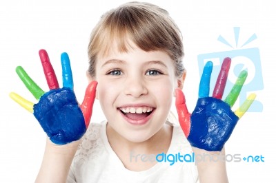 Smiling Girl With Painted Hands Stock Photo