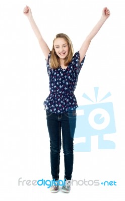 Smiling Girl With Raised Arms Stock Photo