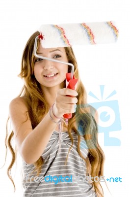 smiling Girl With Roller Brush Stock Photo