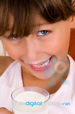 Smiling Girl With The Milk Glass Stock Photo