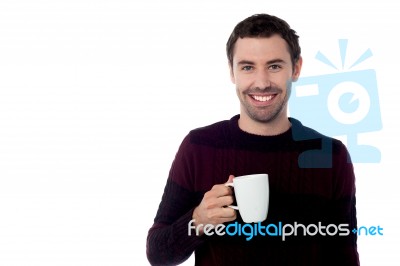 Smiling Guy Enjoying Refreshing Coffee Stock Photo