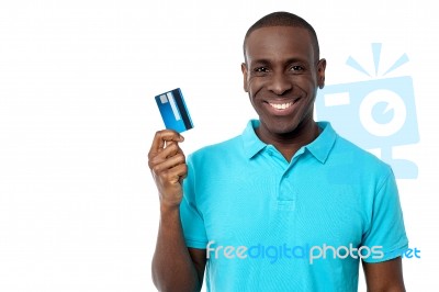 Smiling Guy Holding Credit Card Stock Photo