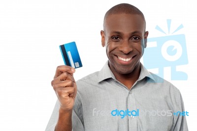 Smiling Guy Holding Credit Card Stock Photo