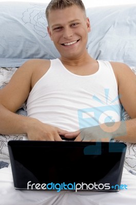 Smiling Guy Posing With Notebook Stock Photo