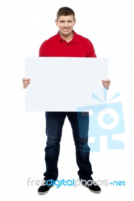 Smiling Guy Presenting Blank Board Stock Photo