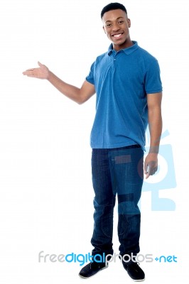 Smiling Guy Redirecting At Something Stock Photo