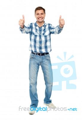 Smiling Guy Showing Thumb Up Stock Photo