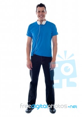 Smiling Guy Standing With Headphone Stock Photo