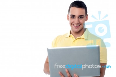 Smiling Guy Working On Laptop Stock Photo