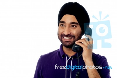 Smiling Indian Man On The Phone Stock Photo