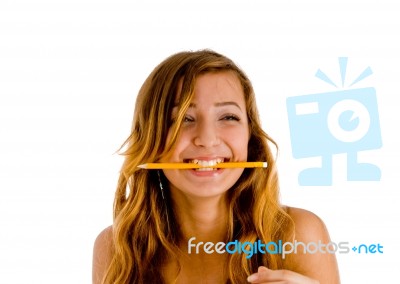 Smiling Lady Biting Pencil Stock Photo