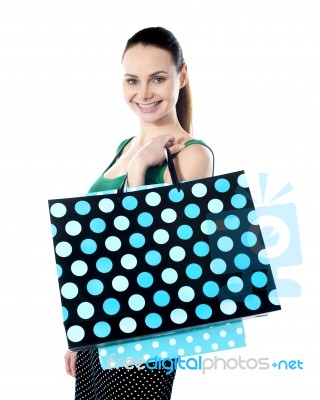 Smiling Lady Holding Shopping Bag Stock Photo