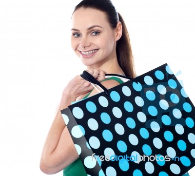 Smiling Lady Holding Shopping Bag Stock Photo