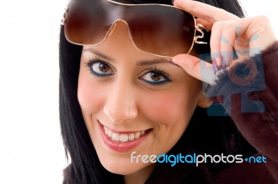 Smiling Lady Holding Sunglasses Stock Photo