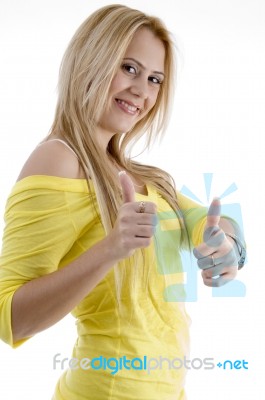 Smiling Lady Showing Good Luck Sign Stock Photo