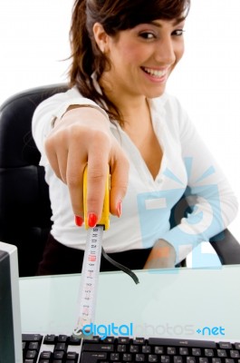 Smiling lady Showing measure Tape Stock Photo