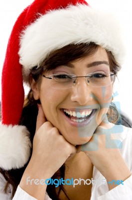 Smiling Lady Wearing Christmas Hat Stock Photo