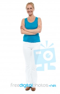 Smiling Lady With Arms Crossed Stock Photo