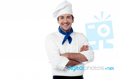 Smiling Male Chef Posing With Arms Crossed Stock Photo