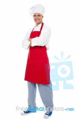 Smiling Male Chef With Crossed Arms Stock Photo