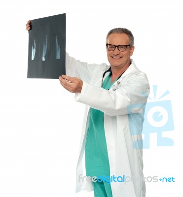 Smiling Male Doctor Holding X Ray Stock Photo